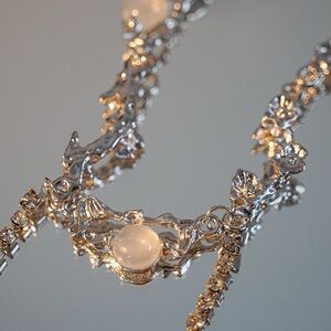 Silver Nature Inspired Necklace with White Stone and Intricate Design